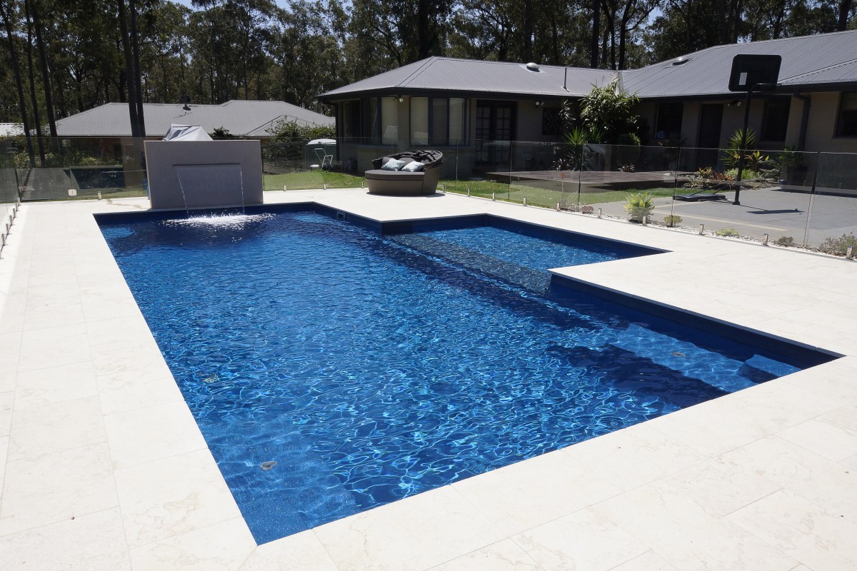 Compass Pools Australia X Trainer 10.2m Pacific with beach water feature Compass Pools Newcastle Compass Pools Australia X Trainer 10.2m Pacific with beach water feature Compass Pools Newcastle