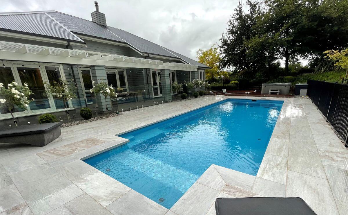 10.2m X Trainer in colour Sapphire with mix and match fencing. Pool installed by Central Pools. Compass Pools Australia X Trainer 10.2m Sapphire Central Pools